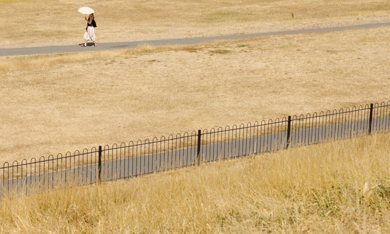 A woman walks in Greenwich Park in London, Britain, July 18, 2022.(Photo: Xinhua)