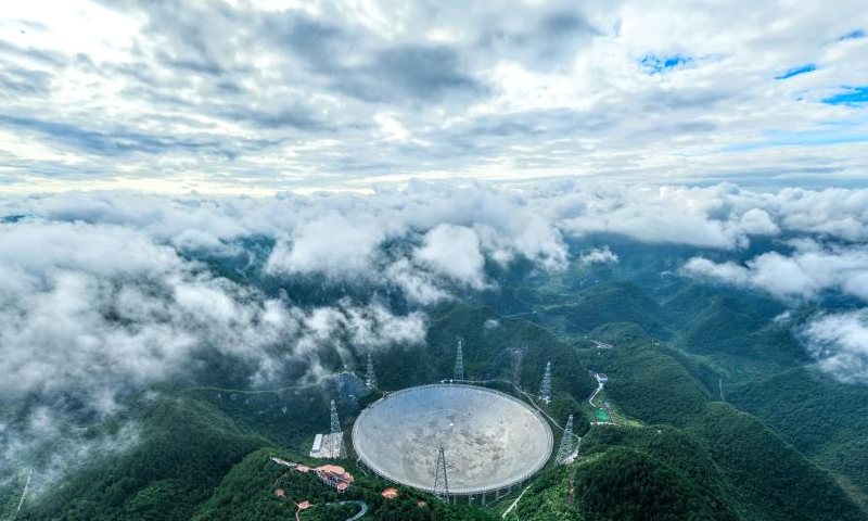 Aerial photo taken on July 21, 2022 shows China's Five-hundred-meter Aperture Spherical Radio Telescope (FAST) under maintenance in southwest China's Guizhou Province. Using FAST, also dubbed as the China Sky Eye, scientists have identified over 660 new pulsars since October 2017. Photo: Xinhua