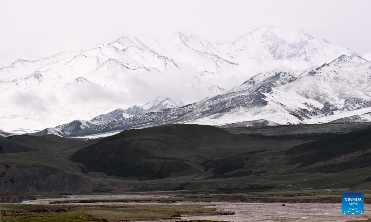 Aerial photo taken on July 21, 2022 shows a view of Mount Anyemaqen of Golog Tibetan Autonomous Prefecture, northwest China's Qinghai Province. Affected by cold air, Golog saw snowfall recently during the summer days. Photo:Xinhua