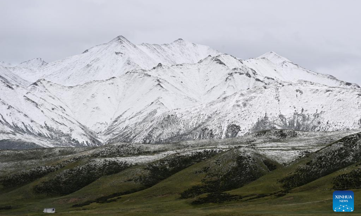 Aerial photo taken on July 21, 2022 shows a view of Mount Anyemaqen of Golog Tibetan Autonomous Prefecture, northwest China's Qinghai Province. Affected by cold air, Golog saw snowfall recently during the summer days. Photo:Xinhua