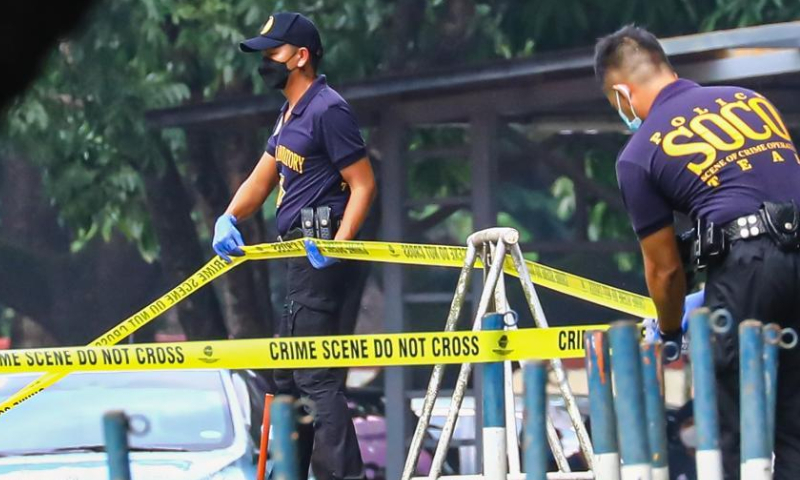 Members of the Philippine National Police inspect the site of a shooting incident at Ateneo de Manila University in Quezon City, the Philippines, July 24, 2022. Three people were killed and two others injured in a shooting incident Sunday afternoon on a university campus in Metro Manila, the Philippine police said. The arrested gunman has admitted to the killing with specific target. Photo: Xinhua