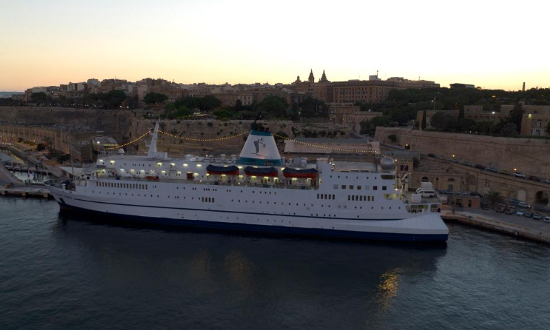 Aerial photo taken on July 12, 2022 shows Logos Hope docked at the Valletta harbor in Valletta, Malta. About 300 people from 60 countries are touring the world on board the largest-ever floating book fair to spread the joy of reading and bring hope and help to the needy. Photo: Xinhua