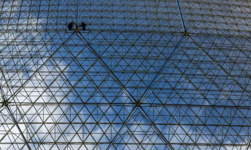 Staff members check reflector panels during a regular maintenance operation on the Five-hundred-meter Aperture Spherical Radio Telescope (FAST) in southwest China's Guizhou Province on July 22, 2022 Using FAST, also dubbed as the China Sky Eye, scientists have identified over 660 new pulsars since October 2017. Photo: Xinhua
