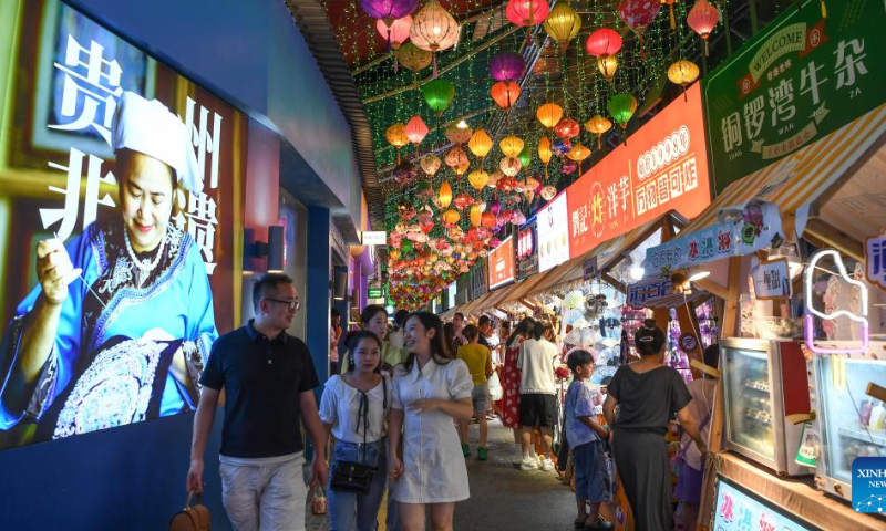People tour a local market at the Qingyun Road in Nanming District of Guiyang, capital city of southwest China's Guizhou Province, July 21, 2022. Photo: Xinhua
