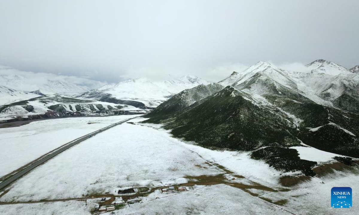 Aerial photo taken on July 21, 2022 shows a view of Mount Anyemaqen of Golog Tibetan Autonomous Prefecture, northwest China's Qinghai Province. Affected by cold air, Golog saw snowfall recently during the summer days. Photo:Xinhua