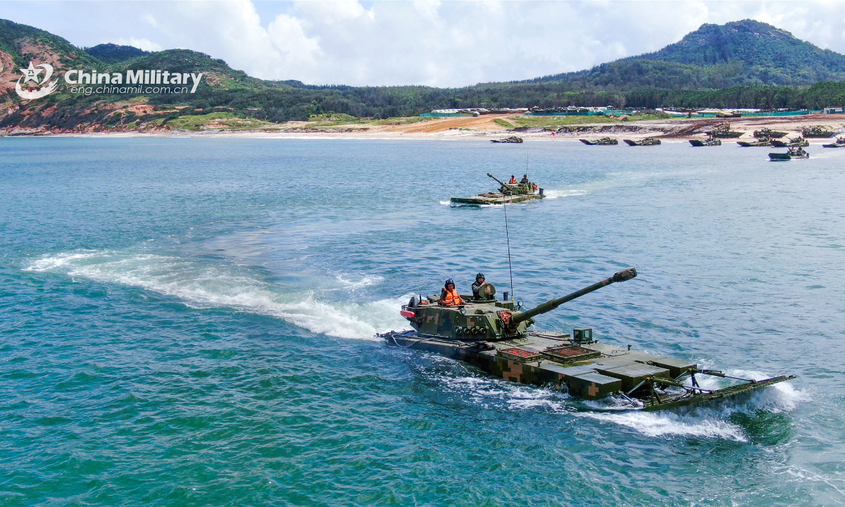 Amphibious armored infantry fighting vehicles (IFV) of an army brigade under the PLA Eastern Theater Command form battle formations in waves during a maritime combat training exercise on June 30, 2022. Photo:China Military