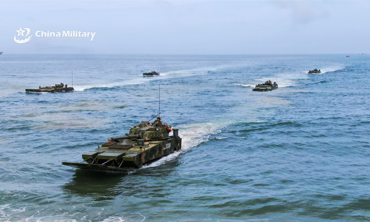 Amphibious armored infantry fighting vehicles (IFV) of an army brigade under the PLA Eastern Theater Command form battle formations in waves during a maritime combat training exercise on June 30, 2022. Photo:China Military