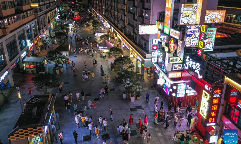 In this aerial photo, people tour the Qingyun Road in Nanming District of Guiyang, capital city of southwest China's Guizhou Province, July 22, 2022.

Qingyun Road was a famous bustling food street at nighttime in the city of Guiyang. Thanks to local planning and years of renovation, the road has turned to be a popular commercial pedestrian street which contains various trendy businesses like cultural innovation and art design while retaining its food street fame.  Photo: Xinhua