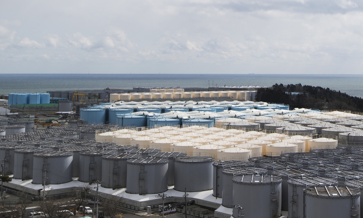Tanks (in gray, beige and blue) storeing water that was treated but is still radioactive after it was used to cool down spent fuel at the Fukushima Daiichi nuclear power plant in Okuma town, Fukushima prefecture, northeastern Japan, on Feb. 27, 2021. Photo: VCG