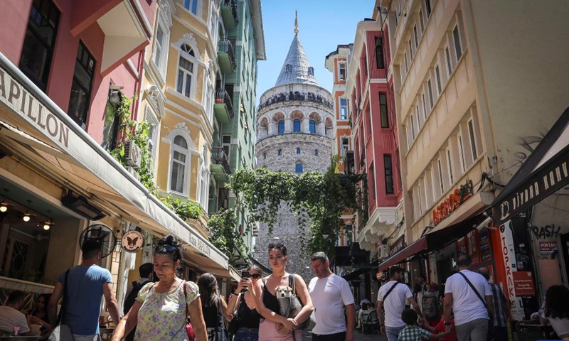 Tourists are seen near the Galata Tower in Istanbul, Türkiye, July 26, 2022. (Xinhua/Shadati)