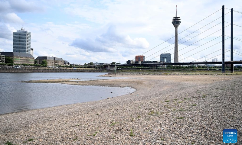 Photo taken on July 26, 2022 shows River Rhine in Dusseldorf, Germany. The water level of River Rhine has dropped due to high temperature and drought. (Photo by Ulrich Hufnagel/Xinhua)