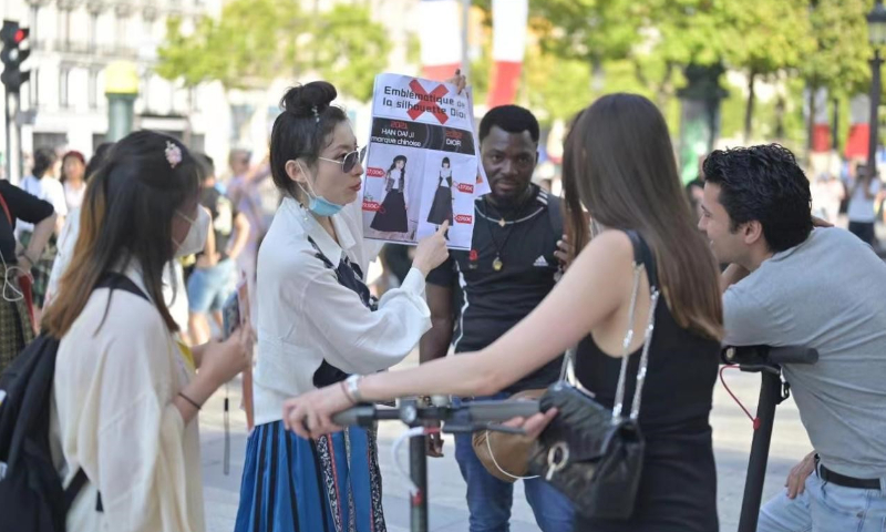 Chinese students in Paris protest outside a Dior store on July 23, 2022 against the brand's 