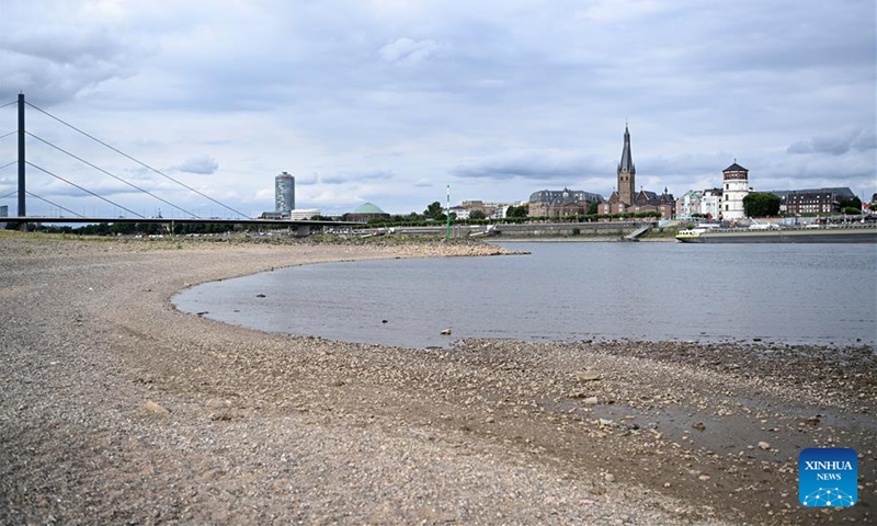 Photo taken on July 26, 2022 shows River Rhine in Dusseldorf, Germany. The water level of River Rhine has dropped due to high temperature and drought. (Photo by Ulrich Hufnagel/Xinhua)
