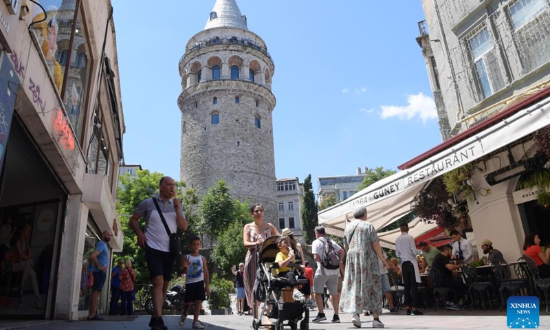 Tourists are seen near the Galata Tower in Istanbul, Türkiye, July 26, 2022. (Xinhua/Shadati)