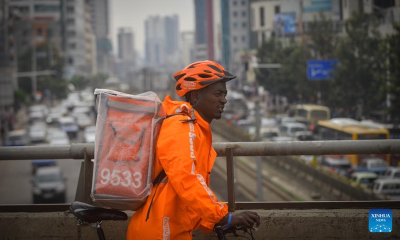 Asnake Nigussie, a bicycle rider working for beU delivery, delivers food in Addis Ababa, Ethiopia, on July 19, 2022.(Photo: Xinhua)
