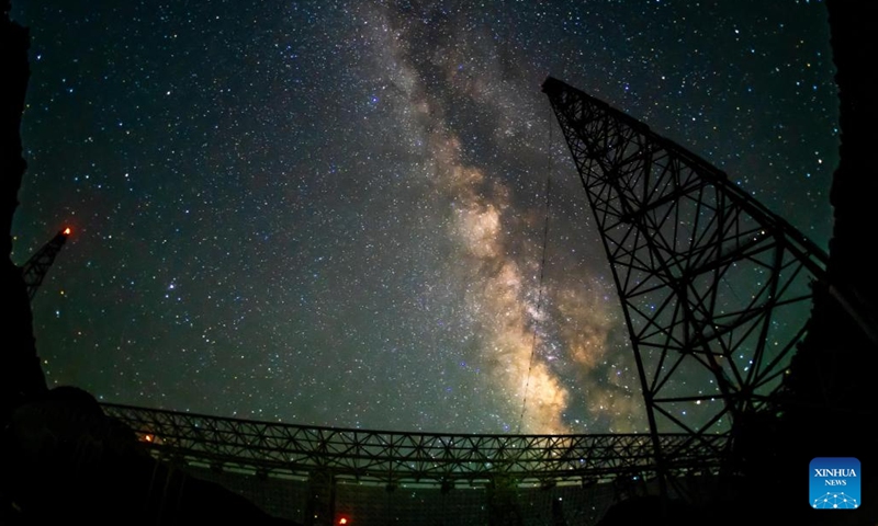 The long-time exposure photo taken on July 24, 2022 shows China's Five-hundred-meter Aperture Spherical Radio Telescope (FAST) under maintenance in southwest China's Guizhou Province. Using FAST, or the China Sky Eye, scientists have identified over 660 new pulsars.(Photo: Xinhua)