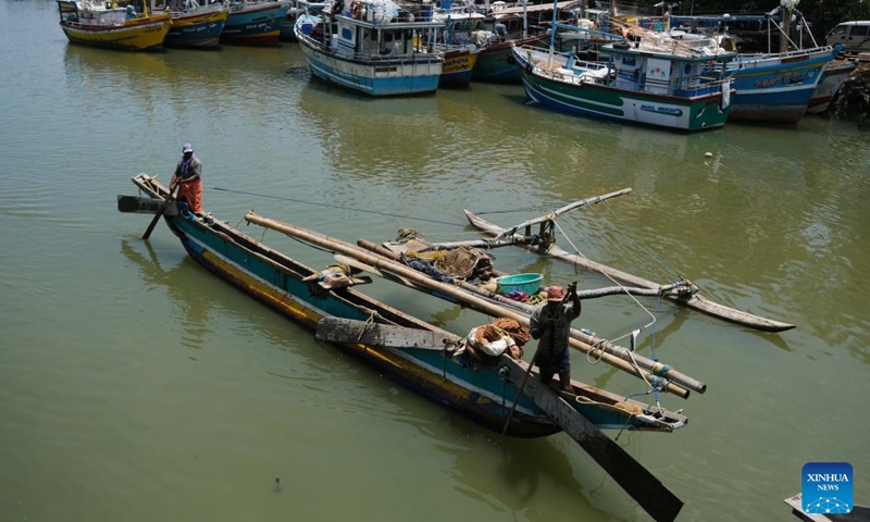 Fishermen work at a fishing village in Negombo, Sri Lanka, July 26, 2022. Due to the shortage of fuel oil, many Sri Lankan fishermen turned to traditional man-powered sailboats to fish for a living.(Photo: Xinhua)