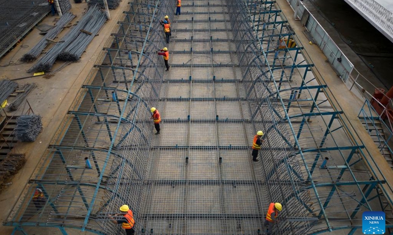 Aerial photo taken on July 25, 2022 shows workers at a beam fabrication yard in Yichun, northeast China's Heilongjiang Province. Crossing permafrost regions, the Harbin-Yichun high-speed railway will total approximately 300 kilometers, connecting the cities of Harbin, Suihua, and Yichun.(Photo: Xinhua)