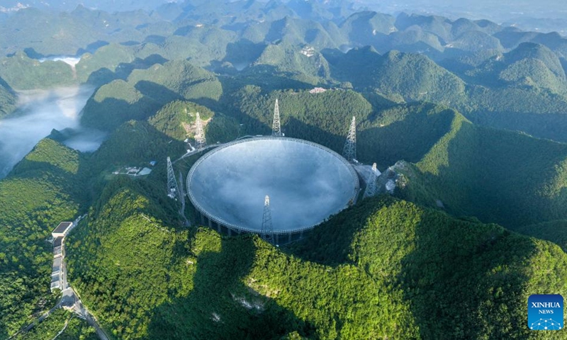 Aerial photo taken on July 25, 2022 shows China's Five-hundred-meter Aperture Spherical Radio Telescope (FAST) under maintenance in southwest China's Guizhou Province. Using FAST, or the China Sky Eye, scientists have identified over 660 new pulsars(Photo: Xinhua)