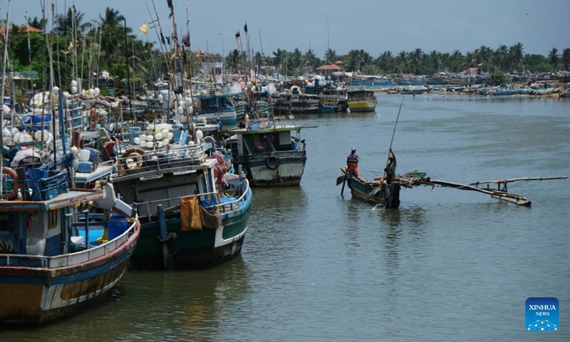 Fishermen work at a fishing village in Negombo, Sri Lanka, July 26, 2022. Due to the shortage of fuel oil, many Sri Lankan fishermen turned to traditional man-powered sailboats to fish for a living.(Photo: Xinhua)