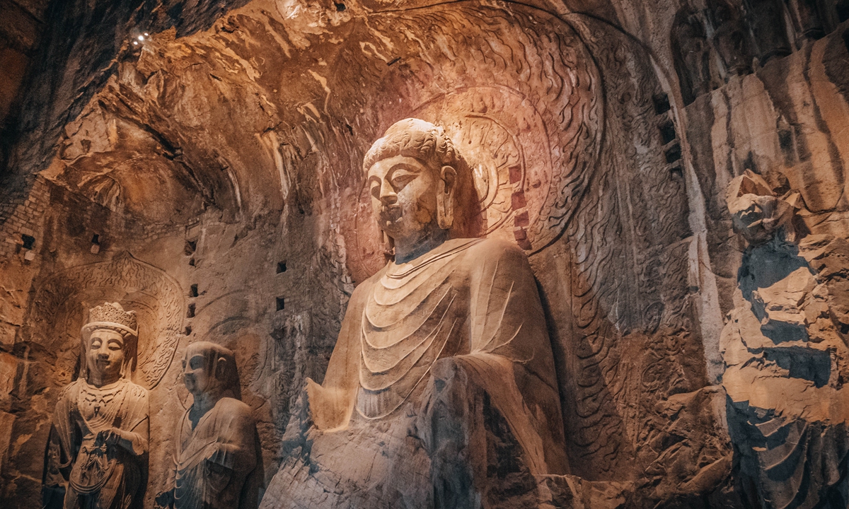 The Vairocana Buddha statue at Longmen Grottoes Photo: VCG <em>The Remaining Charm of Longmen</em> brooch collection by Jing Zhihao 
Photo: Courtesy of Jing Zhihao