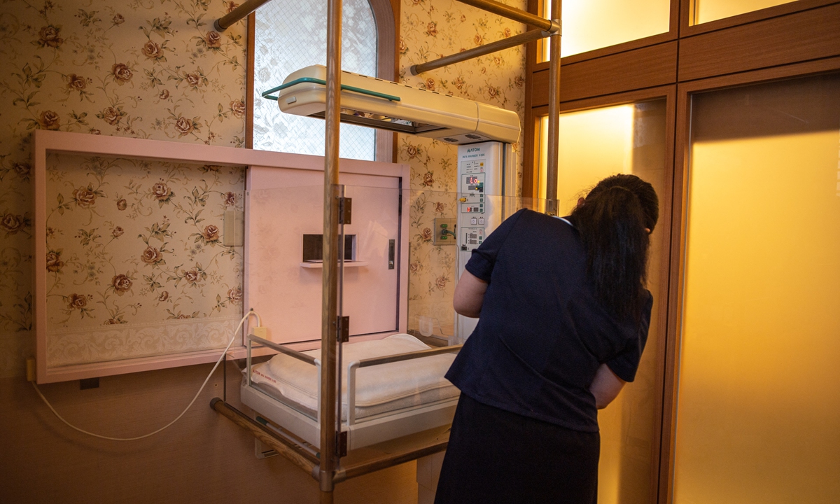 A staff member shows the baby hatch room in Jikei hospital in Kumamoto, Japan on June 10, 2022. Photo: AFP
