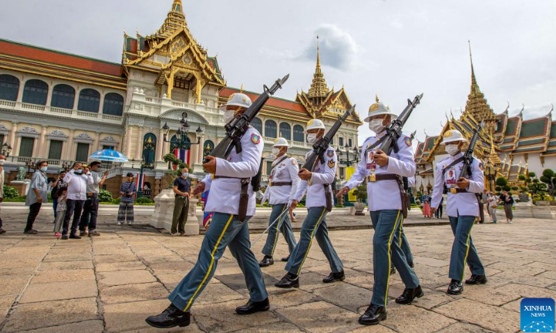 Tourists watch guards on patrol at the Grand Palace scenic spot in Bangkok, Thailand, on July 31, 2022. Thailand received more than 2 million foreign tourists in the first half of 2022. According to the forecast of the Ministry of Tourism and Sports, the number of tourists is expected to reach 9 million in this year. Photo: Xinhua