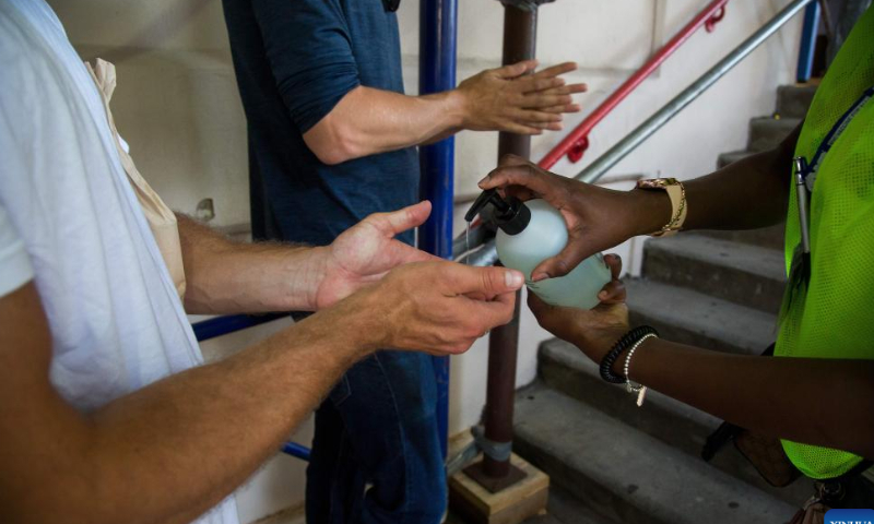 A man sanitizes his hands at a monkeypox vaccination site in the Brooklyn borough of New York, the United States, on July 30, 2022. New York Governor Kathy Hochul declared a state disaster emergency late Friday night due to the growing monkeypox cases in the state. Photo: Xinhua