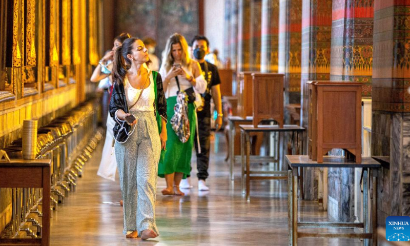 Tourists are seen at the Wat Pho temple in Bangkok, Thailand, on July 31, 2022. Thailand received more than 2 million foreign tourists in the first half of 2022. According to the forecast of the Ministry of Tourism and Sports, the number of tourists is expected to reach 9 million in this year. Photo: Xinhua