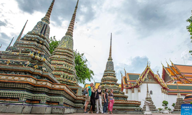 Tourists are seen at the Wat Pho temple in Bangkok, Thailand, on July 31, 2022. Thailand received more than 2 million foreign tourists in the first half of 2022. According to the forecast of the Ministry of Tourism and Sports, the number of tourists is expected to reach 9 million in this year. Photo: Xinhua