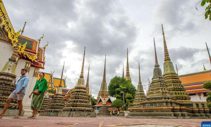 Tourists are seen at the Wat Pho temple in Bangkok, Thailand, on July 31, 2022. Thailand received more than 2 million foreign tourists in the first half of 2022. According to the forecast of the Ministry of Tourism and Sports, the number of tourists is expected to reach 9 million in this year. Photo: Xinhua