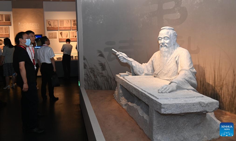 Visitors look at exhibits at the Xi'an branch of the National Archives of Publications and Culture in Xi'an, northwest China's Shaanxi Province, July 30, 2022. Photo: Xinhua 