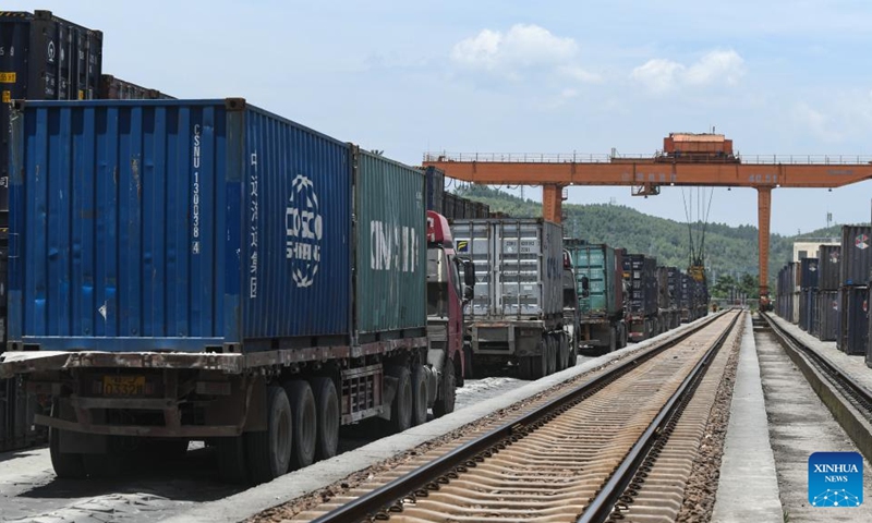 Photo taken on July 29, 2022 shows containers at a railway freight center in Wuzhou, south China's Guangxi Zhuang Autonomous Region. Launched in 2017, the New International Land-Sea Trade Corridor is a trade and logistics passage jointly built by western Chinese provinces and ASEAN countries. (Xinhua/Zhang Ailin)