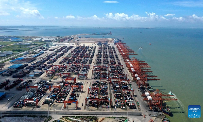 Aerial photo taken on July 9, 2022 shows the container terminal at Qinzhou Port in south China's Guangxi Zhuang Autonomous Region. Launched in 2017, the New International Land-Sea Trade Corridor is a trade and logistics passage jointly built by western Chinese provinces and ASEAN countries. (Xinhua/Zhang Ailin)