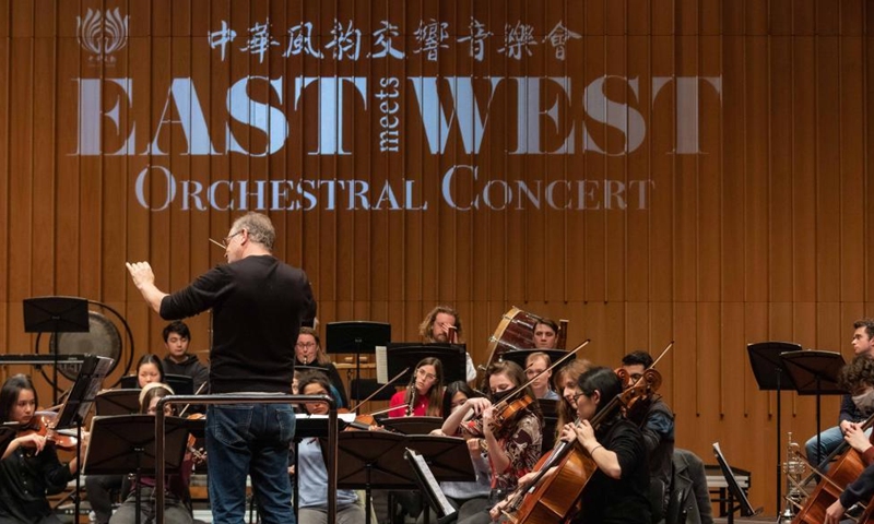Photo taken on July 30, 2022 shows the opening performance of Jasmine Flower by Australian conductor Guy Noble at the East Meets West orchestral concert in Llewellyn Hall at the Australian National University in Canberra, Australia. East Meets West orchestral concert tour in Australia was held in Canberra on Saturday night. (Photo by Chu Chen/Xinhua)