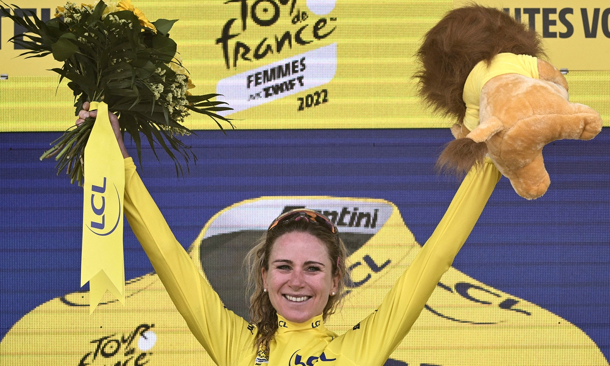 Movistar Team's Dutch rider Annemiek Van Vleuten celebrates her overall leader yellow jersey on the podium at the end of the 7th stage of the new edition of the Women's Tour de France cycling race, 127,1 km between Selestat and Le Markstein on July 30, 2022. Photo: AFP