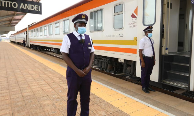 Train conductor Joseph Mwangi waits for confirmation of departure information at Mtito Andei Station on the Mombasa-Nairobi Railway, Kenya, July 29, 2022. Launched on May 31, 2017, the 480 km Mombasa-Nairobi Standard Gauge Railway (SGR), financed mainly by China and constructed by China Road and Bridge Corporation (CRBC), has fostered job creation for local people. Photo: Xinhua