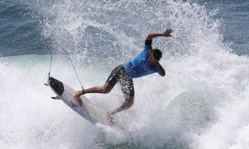 A surfer is seen during the competition of the Vans US Open of Surfing at Huntington Beach, California, the United States on Aug. 7, 2022. (Xinhua)