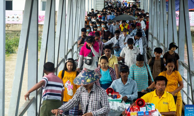 People wait to board a ferry in Dala Township, Myanmar, on Aug. 6, 2022. Myanmar has recorded no new COVID-19 deaths over the past 122 days, the longest stretch without any fatalities from the virus since the start of the pandemic in the country, the Ministry of Health said on Saturday. Photo: Xinhua