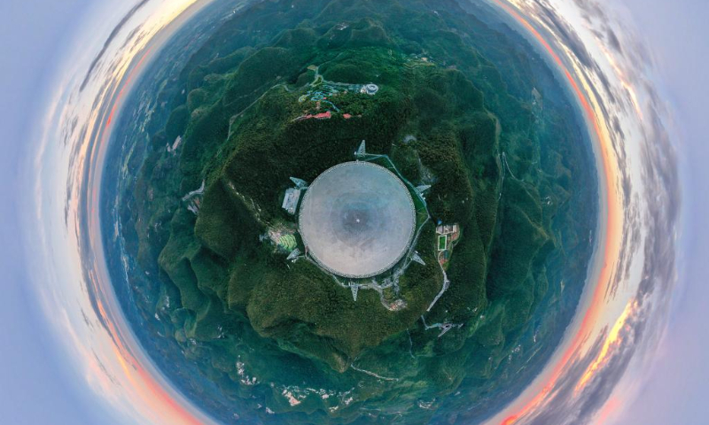 Aerial photo taken on Aug. 28, 2019 shows a panoramic view of China's Five-hundred-meter Aperture Spherical Radio Telescope (FAST) in southwest China's Guizhou Province.
Located in a naturally deep and round karst depression in southwest China's Guizhou Province, FAST started formal operation in January 2020 and officially opened to the world on March 31, 2021. It is believed to be the world's most sensitive radio telescope. With FAST, scientists have identified over 660 new pulsars. (Xinhua/Ou Dongqu)