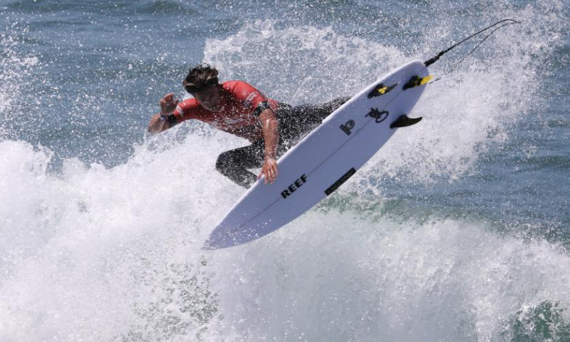 A surfer is seen during the competition of the Vans US Open of Surfing at Huntington Beach, California, the United States on Aug. 7, 2022. (Xinhua)