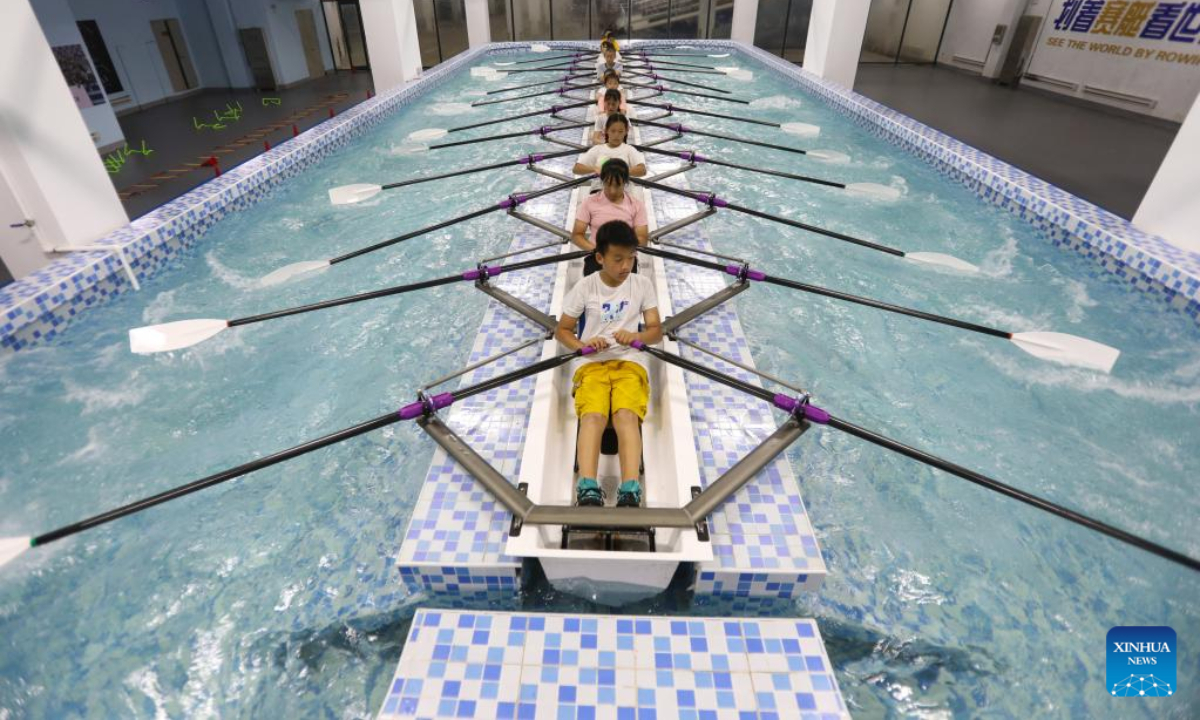 Children practise canoeing as part of a summer caring program at a primary school in Shenyang, northeast China's Liaoning Province, Aug 4, 2022. Photo:Xinhua