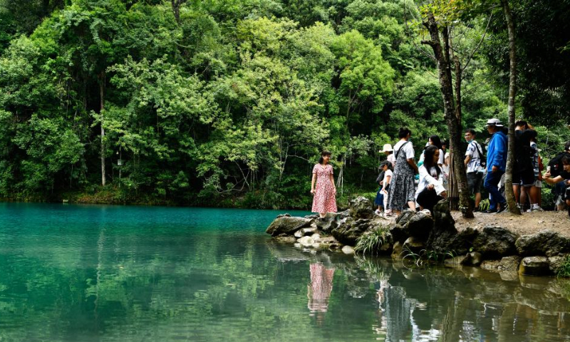 Tourists visit Xiaoqikong scenic spot in Libo County, southwest China's Guizhou Province, Aug. 6, 2022. The county has been promoting tourism consumption under COVID-19 prevention and control measures. Photo: Xinhua