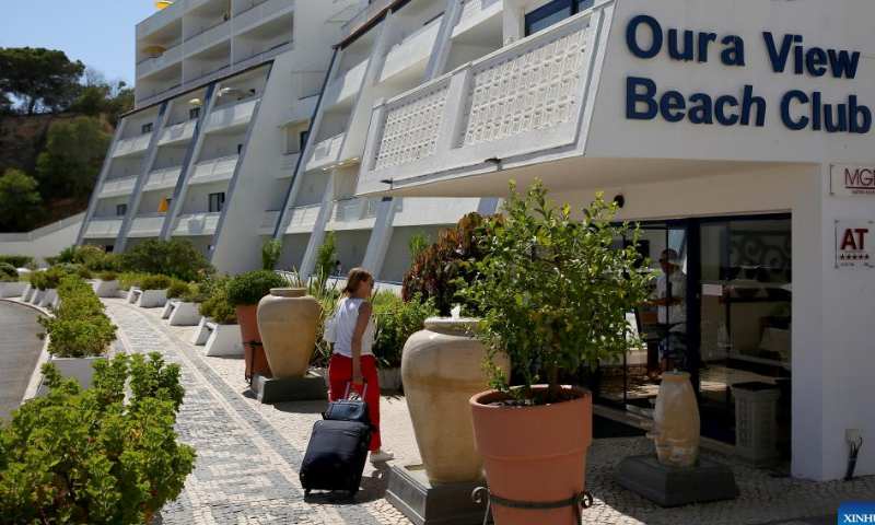 A tourist arrives at a hotel in Albufeira, Algarve region, Portugal on Aug. 6, 2022. Tourism is rebounding quickly in Portugal. Photo: Xinhua