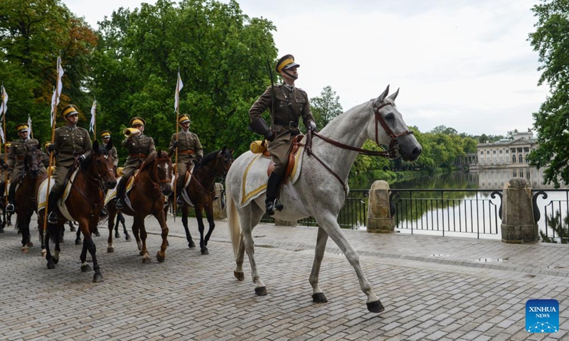 Members of the Polish cavalry parade along the alleys of Lazienki Royal Park during a Warsaw Cavalry Day event in Warsaw, Poland, on July 30, 2022. (Photo by Alexey Vitvitsky/Xinhua)