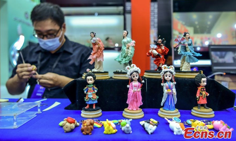 Dough sculptures are on display during an intangible cultural heritage exhibition in Xinjiang Art Museum, Urumqi, northwest China's Xinjiang Uyghur Autonomous Region, July 31, 2022. The exhibition showcases 193 intangible cultural heritage projects from 19 provincial-level regions and 146 such projects from Xinjiang. (Photo: China News Service/Liu Xin)