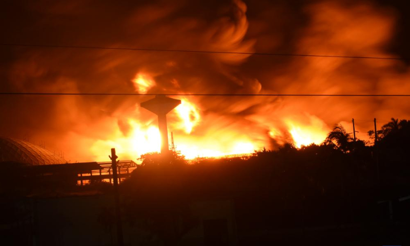 Thick smoke is seen from the burning fuel storage tank near the port of Matanzas, Cuba, Aug. 7, 2022. At least one person was killed and 122 injured in a large-scale fire following a series of explosions at a fuel storage facility in Cuba, the Ministry of Public Health said Sunday, adding that 16 others were still missing in the accident.  Photo: Xinhua
