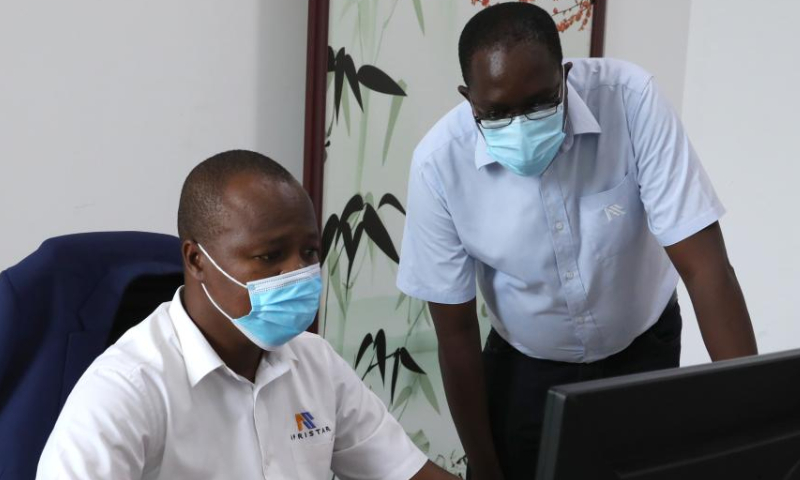 Mombasa Terminus station master Cosmas Makewa (R) and passenger transportation director Peterson Njeru Gitonga work in an office in Mombasa, Kenya, July 27, 2022. Launched on May 31, 2017, the 480 km Mombasa-Nairobi Standard Gauge Railway (SGR), financed mainly by China and constructed by China Road and Bridge Corporation (CRBC), has fostered job creation for local people. Photo: Xinhua