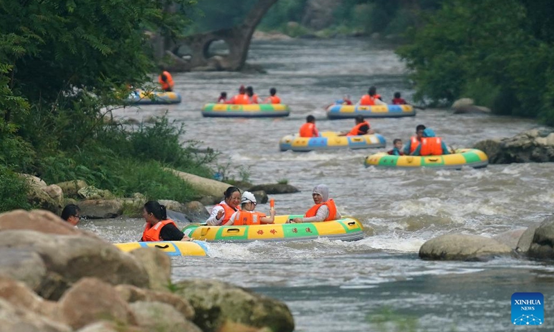 People enjoy drifting at a canyon in Meiling scenic spot in Nanchang, capital of east China's Jiangxi Province on Aug. 2, 2022. (Xinhua/Wan Xiang)