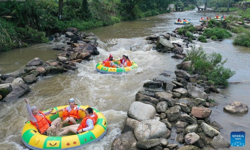 Aerial photo taken on Aug. 2, 2022 shows people enjoying drifting at a canyon in Meiling scenic spot in Nanchang, capital of east China's Jiangxi Province. (Xinhua/Wan Xiang)